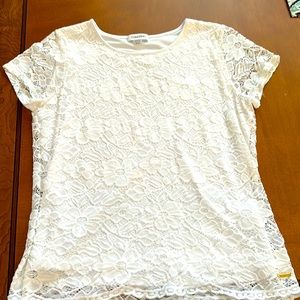 Calvin Klein Woman’s lace top with flower design. Size Medium. White